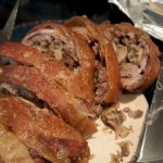 Carved roasted stuffed breast of lamb