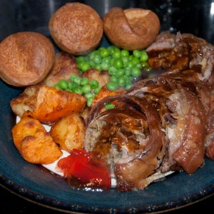 Roast breast of lamb with all the trimmings, served and ready to enjoy
