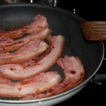 Frying bacon in pan