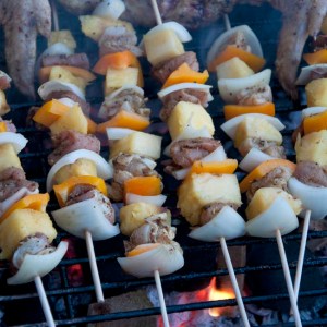 Kebabs cooking over charcoal