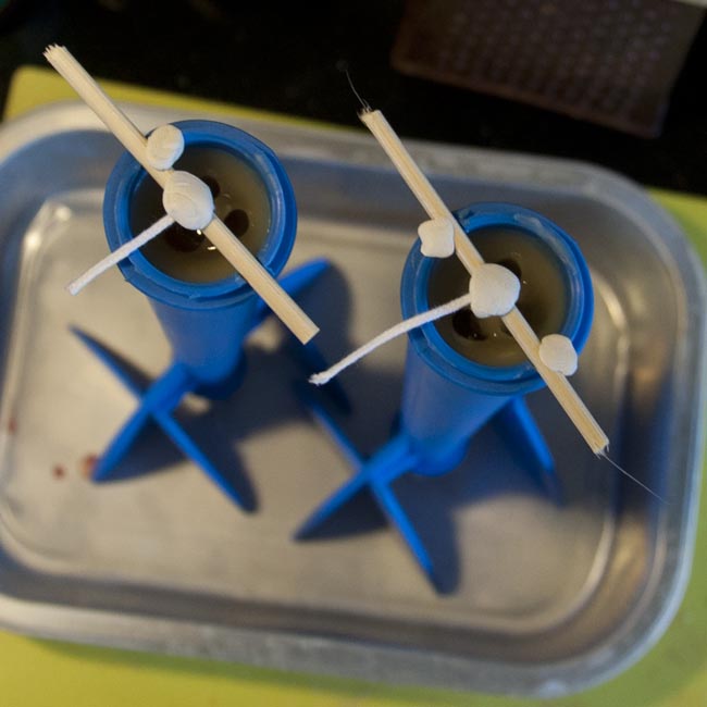 Candles with voids around wicks