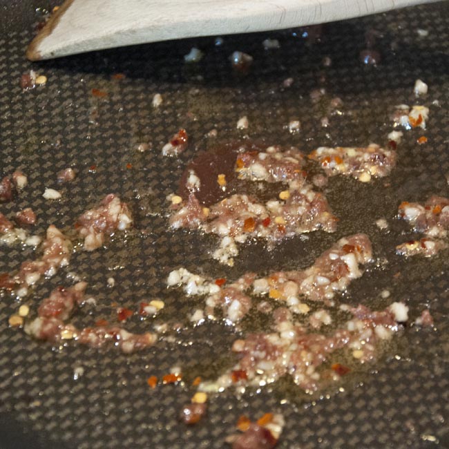 Fry the anchovy, garlic and chilli