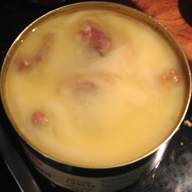 Opened tin of duck confit