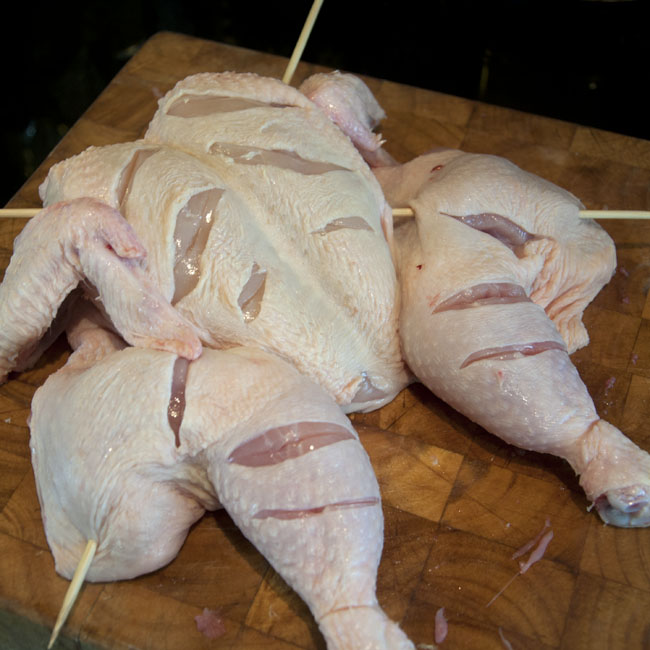 Make incisions into chicken